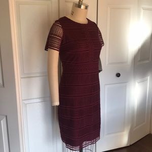 Lace dress, short sleeve, burgundy coloured with knit lining.